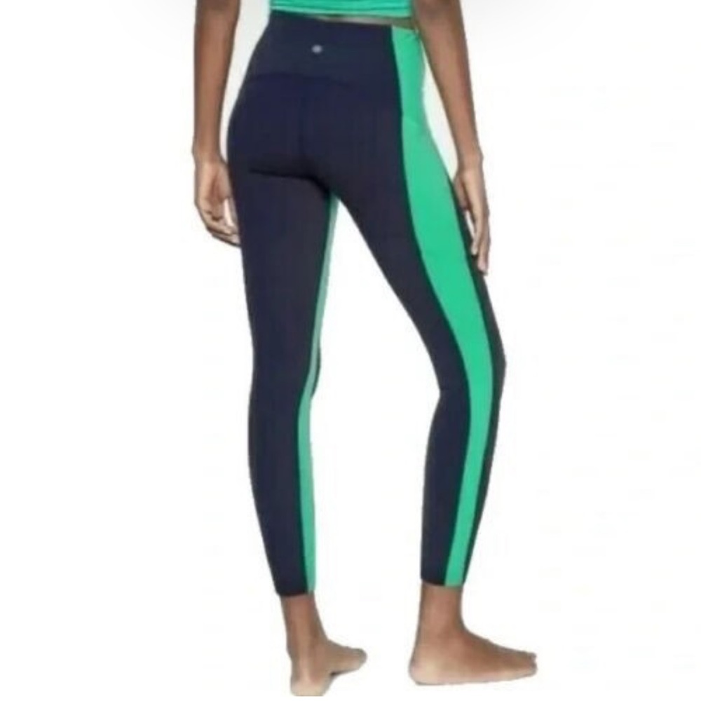High waisted Athleta leggings with side pocket - navy blue with green stripe